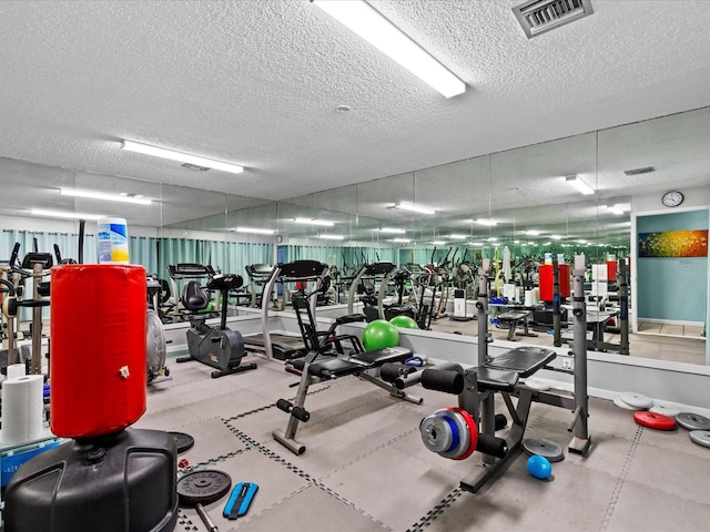 gym with a textured ceiling