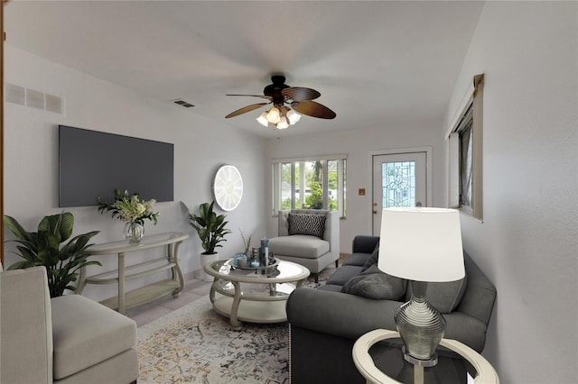 living room with light tile patterned floors and ceiling fan