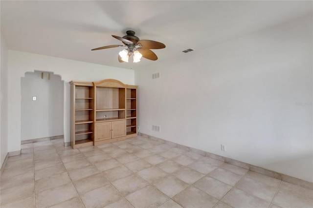 unfurnished room featuring ceiling fan and light tile patterned flooring