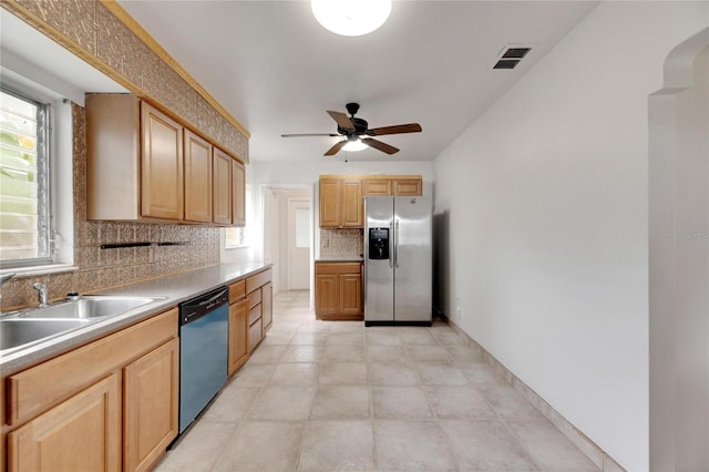 kitchen with ceiling fan, appliances with stainless steel finishes, backsplash, and sink