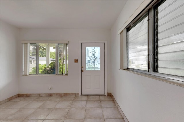 entrance foyer featuring light tile patterned flooring