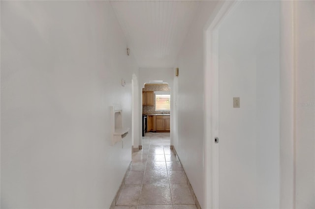 corridor with light tile patterned flooring