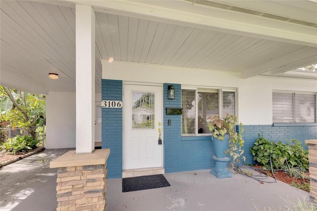 entrance to property with a porch