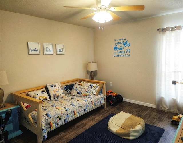 bedroom featuring ceiling fan and dark hardwood / wood-style floors