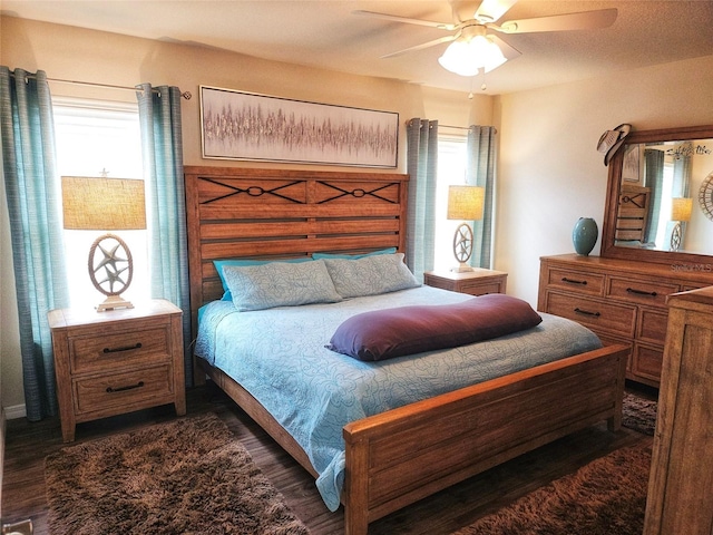 bedroom featuring dark hardwood / wood-style floors and ceiling fan