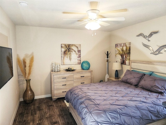 bedroom with dark wood-type flooring and ceiling fan