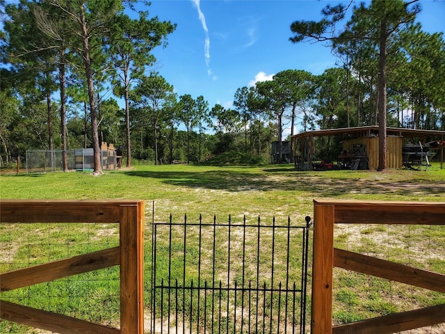 view of yard with a gate and fence