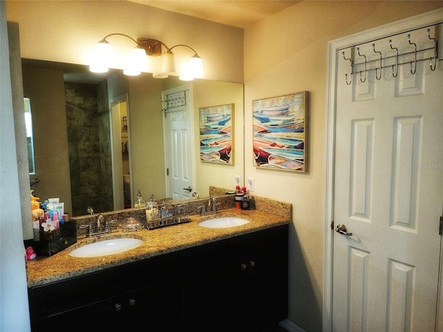 bathroom with double vanity and a sink