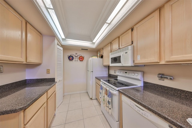 kitchen featuring white appliances, light tile patterned floors, light brown cabinetry, crown molding, and a raised ceiling