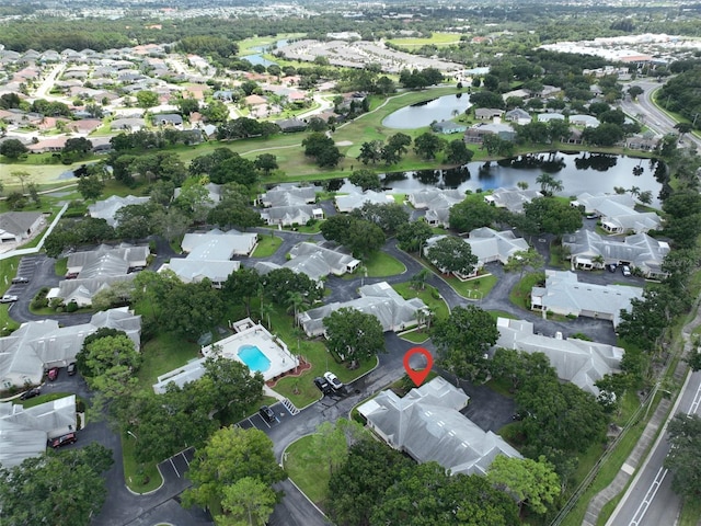 birds eye view of property featuring a residential view and a water view