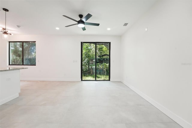 spare room with ceiling fan