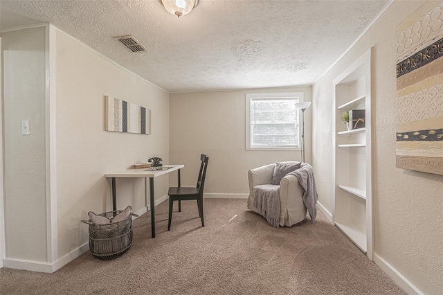 office with a textured ceiling and carpet floors