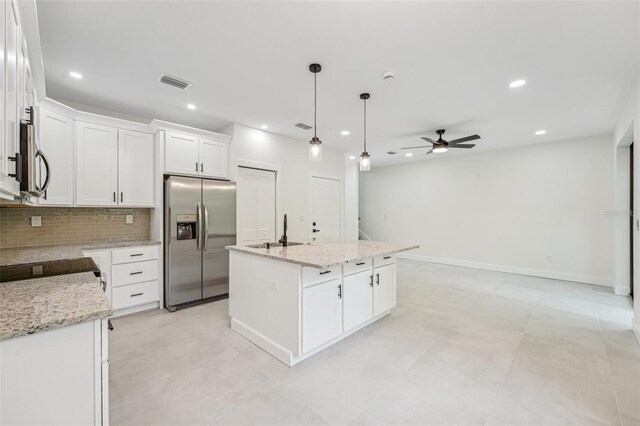 kitchen with a kitchen island with sink, white cabinetry, sink, ceiling fan, and appliances with stainless steel finishes