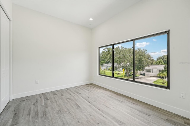 unfurnished room featuring light hardwood / wood-style flooring