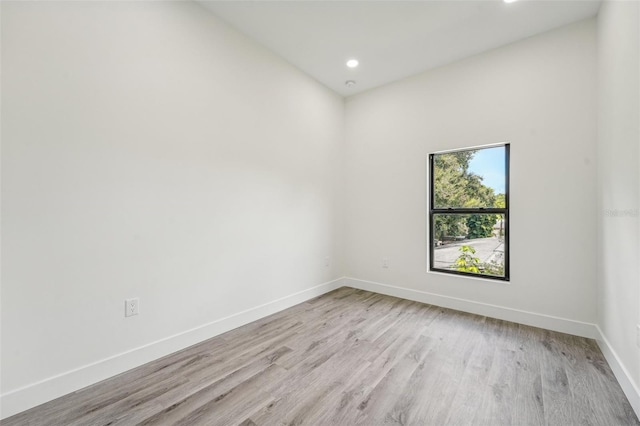 unfurnished room with light hardwood / wood-style floors