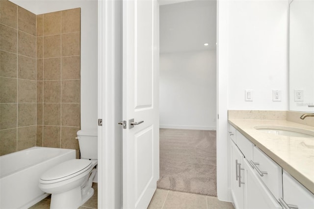 bathroom featuring vanity, toilet, a bathtub, and tile patterned flooring