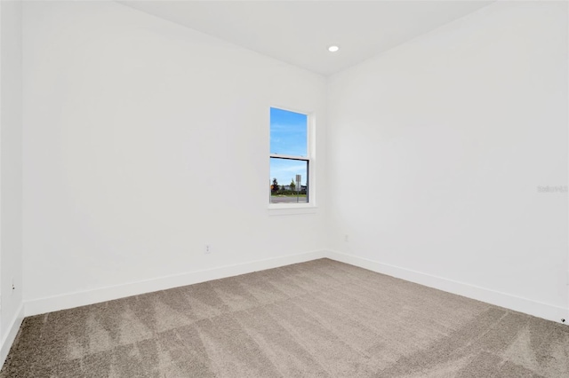 unfurnished room with carpet flooring, recessed lighting, and baseboards