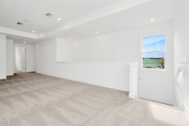 empty room with recessed lighting, visible vents, baseboards, and light colored carpet