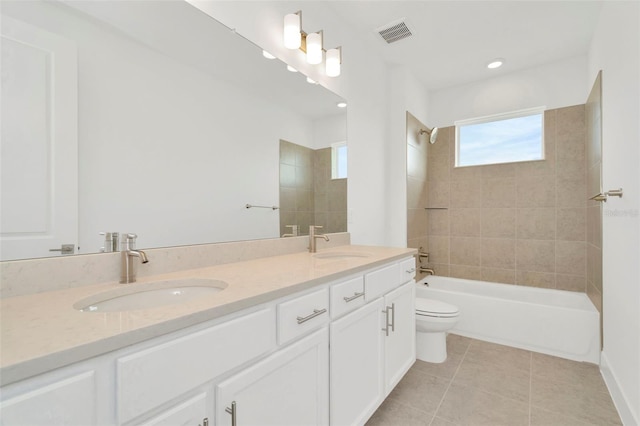 full bathroom featuring tile patterned floors, visible vents, double vanity, and a sink