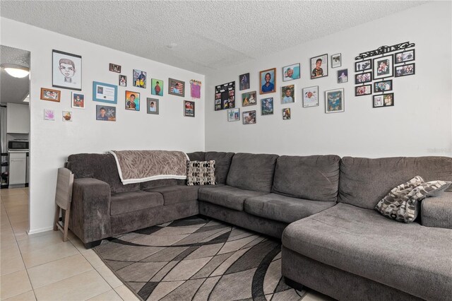 tiled living room with a textured ceiling