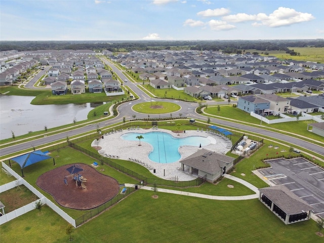 bird's eye view with a residential view and a water view