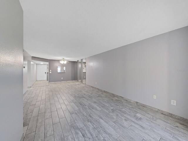 unfurnished living room featuring light hardwood / wood-style flooring