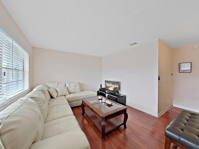 living room featuring dark hardwood / wood-style flooring