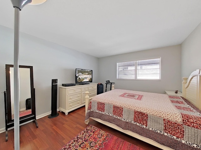 bedroom with hardwood / wood-style floors