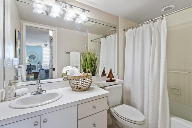 full bathroom featuring vanity, toilet, and shower / bath combo with shower curtain