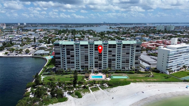 drone / aerial view featuring a view of the beach and a water view