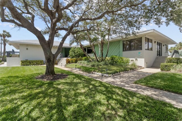 view of home's exterior featuring a lawn