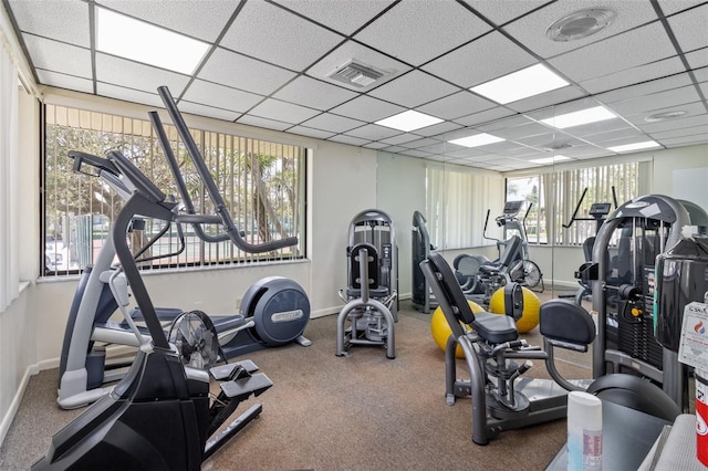 gym featuring a paneled ceiling