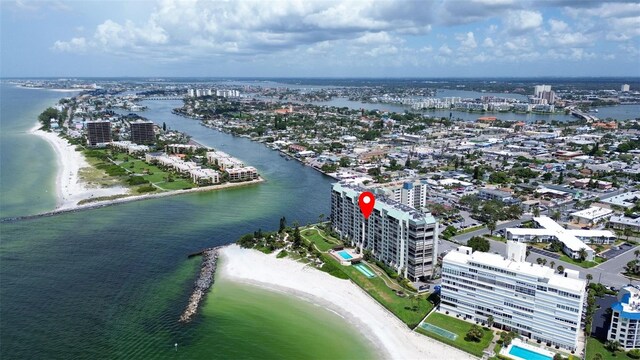 drone / aerial view featuring a water view and a view of the beach