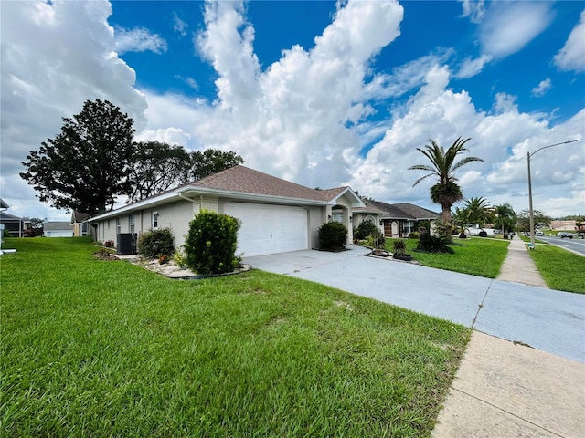 view of side of home with a garage and a yard