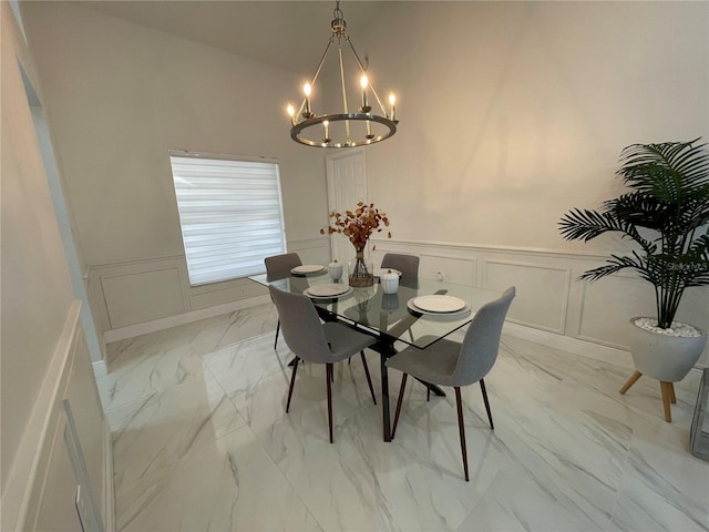 dining space with an inviting chandelier