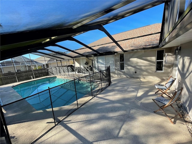 view of pool featuring a patio and glass enclosure