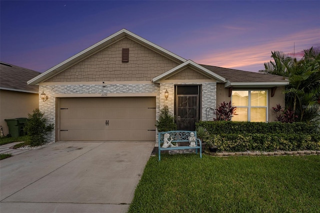 view of front of house with a lawn and a garage