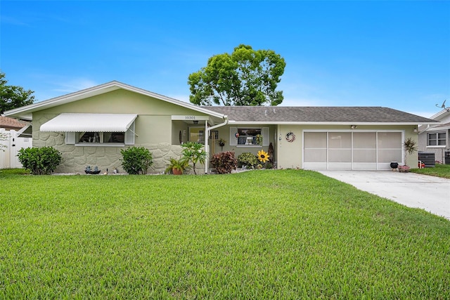 ranch-style home with a front lawn and a garage