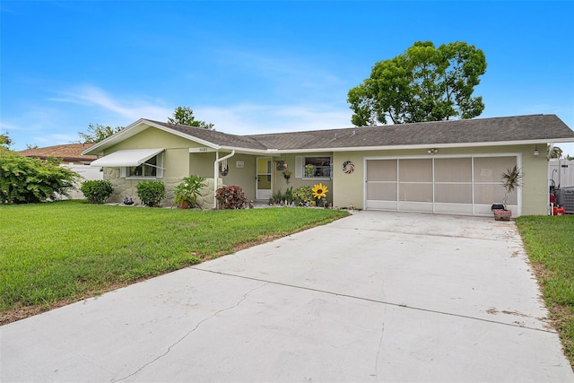 ranch-style home featuring a garage and a front yard