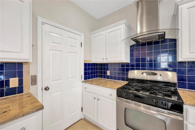 6419 Marbella Blvd, Apollo Beach, FL 33572 - kitchen featuring gas stove, island range hood, decorative backsplash, and white cabinetry
