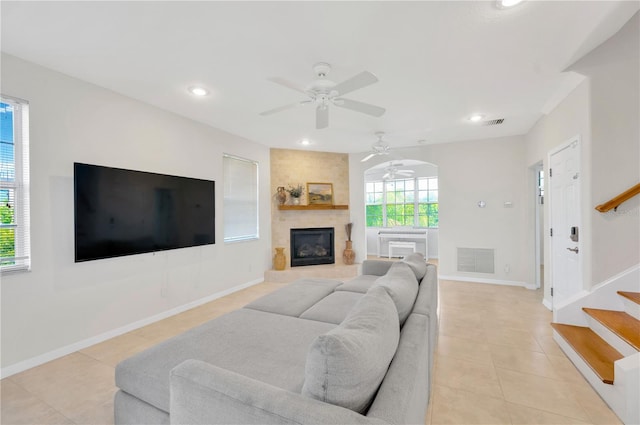 6419 Marbella Blvd, Apollo Beach, FL 33572 - living area with light tile patterned floors, ceiling fan, recessed lighting, stairs, and a fireplace