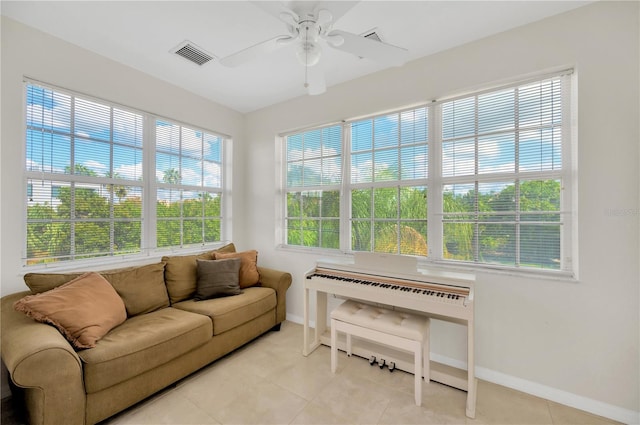 6419 Marbella Blvd, Apollo Beach, FL 33572 - living room with baseboards, a ceiling fan, and light tile patterned flooring