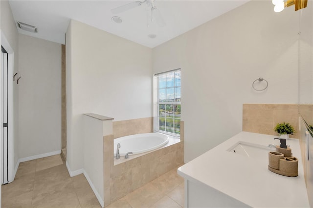 6419 Marbella Blvd, Apollo Beach, FL 33572 - bathroom featuring a garden tub, vanity, tile patterned floors, and a ceiling fan