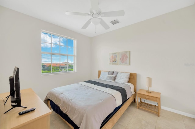 6419 Marbella Blvd, Apollo Beach, FL 33572 - bedroom featuring light tile patterned floors, a ceiling fan, and baseboards