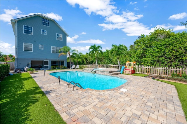 6419 Marbella Blvd, Apollo Beach, FL 33572 - view of swimming pool featuring a patio area, a playground, and a pool with connected hot tub