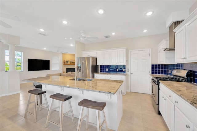 6419 Marbella Blvd, Apollo Beach, FL 33572 - kitchen with stainless steel appliances, a ceiling fan, a sink, light tile patterned floors, and recessed lighting