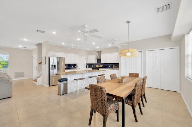6419 Marbella Blvd, Apollo Beach, FL 33572 - dining room with ceiling fan, baseboards, light tile patterned floors, recessed lighting, and stairway
