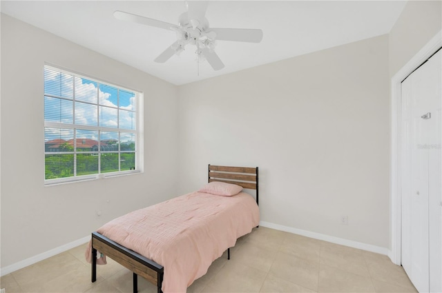 6419 Marbella Blvd, Apollo Beach, FL 33572 - bedroom featuring baseboards, a ceiling fan, and light tile patterned floors