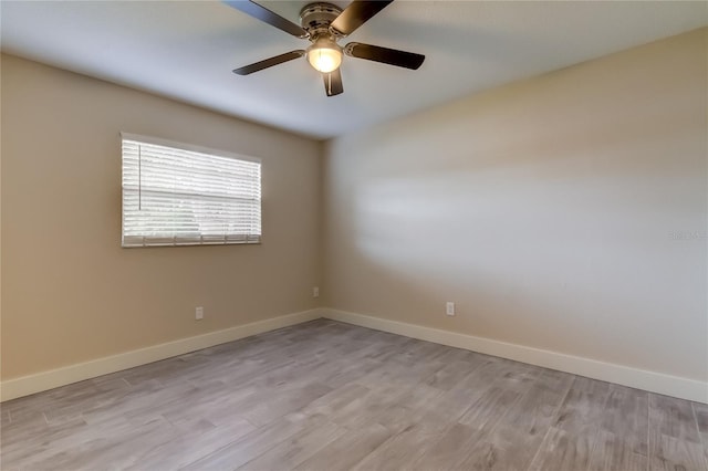 spare room with ceiling fan and light hardwood / wood-style floors