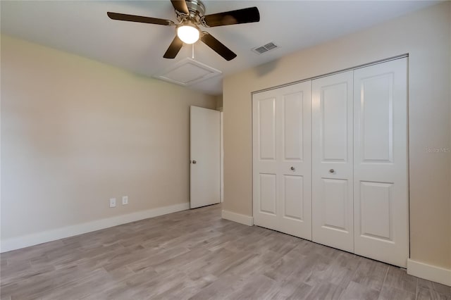 unfurnished bedroom featuring a closet, ceiling fan, and light hardwood / wood-style flooring